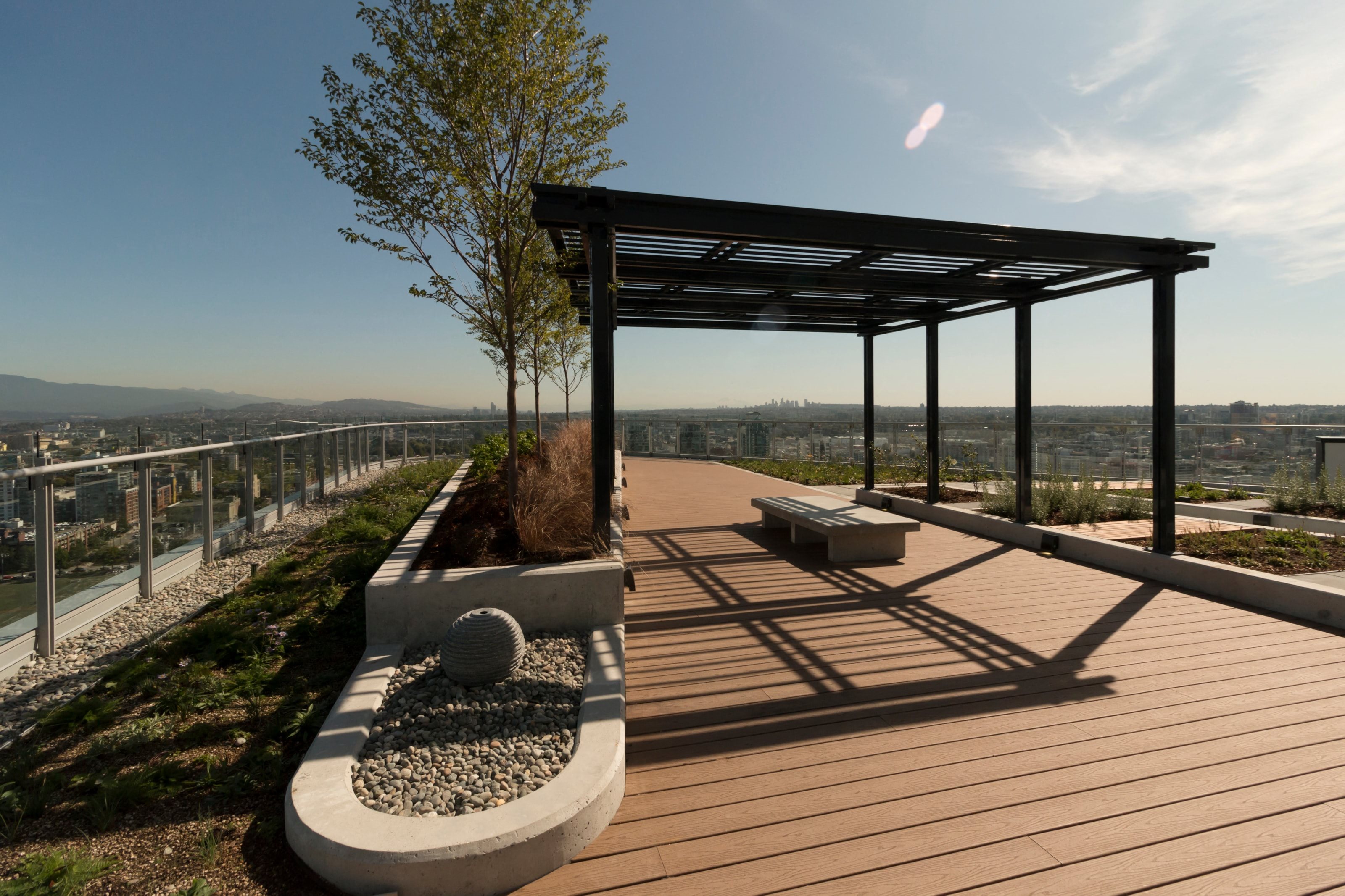 a deck with benches and a view of the city