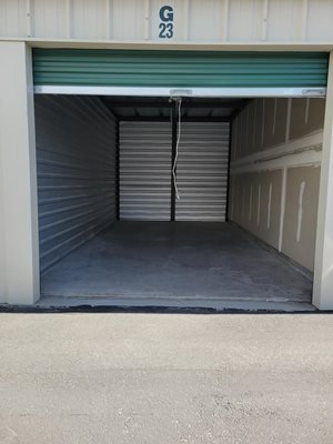 A storage unit with the number G23 on the door.