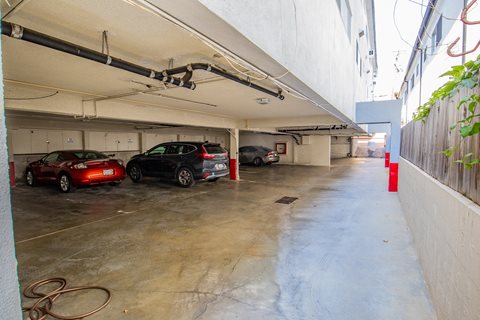 a parking garage with cars parked in it