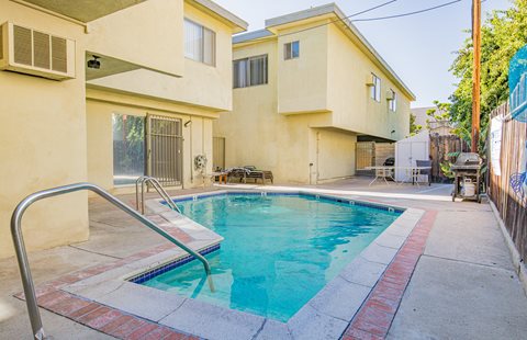 a swimming pool in front of a house
