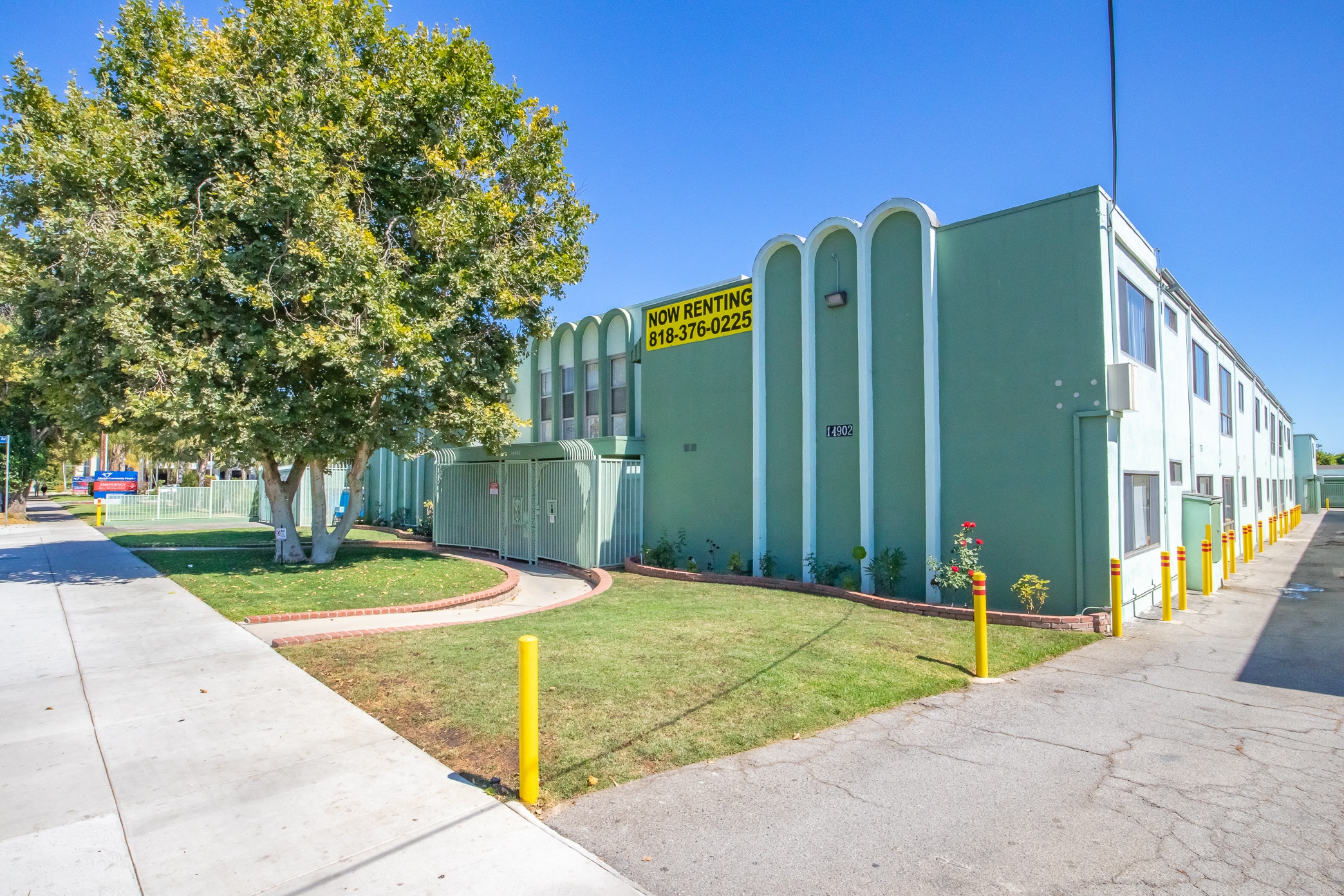 a building with a yellow street sign in front of it