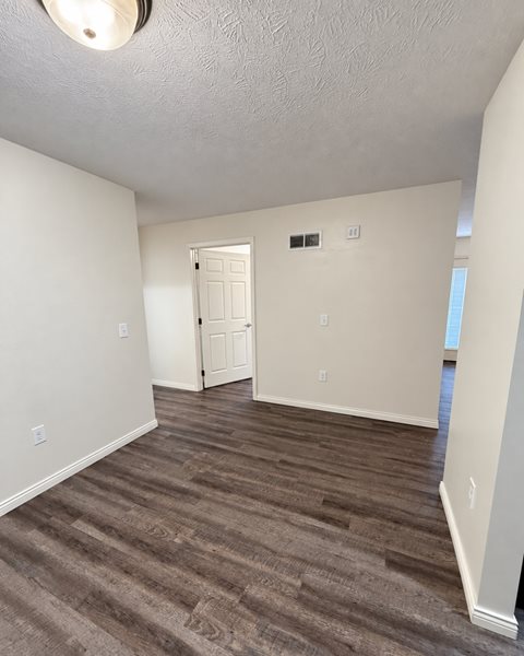 A room with a door and a window.