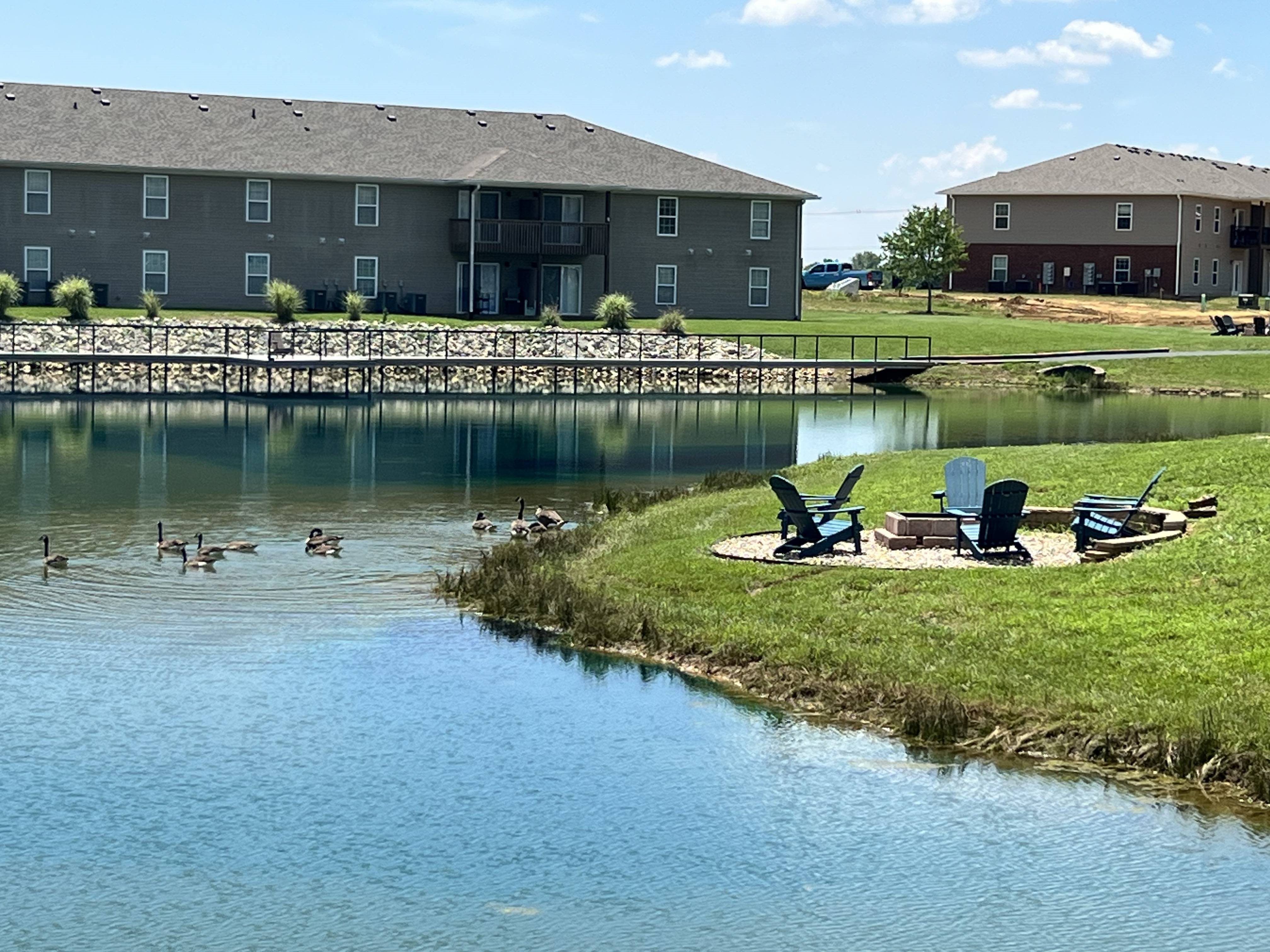 Fishing pond with walking path and fire pits