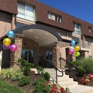 a house with balloons in front of it