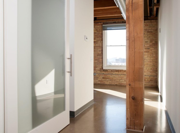 Translucent Sliding Door with White Frame to Entrance of Master Bedroom at Minneapolis MN Apartment
