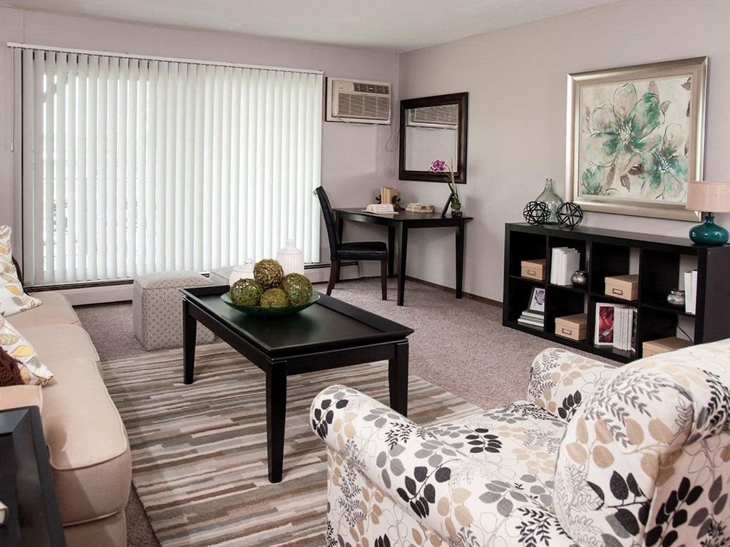 Living room with sofa and center table1 at Terra Pointe Apartments, Saint Paul, Minnesota