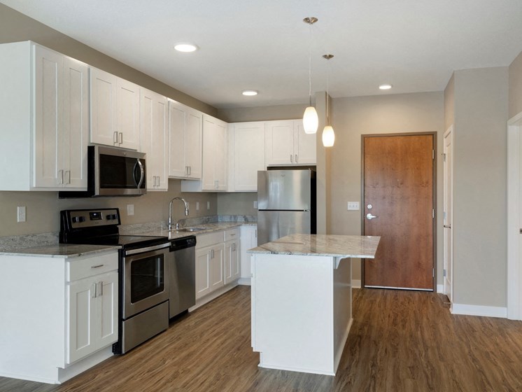 Large kitchen w/island at The Liberty Apartments and Townhomes in Golden Valley