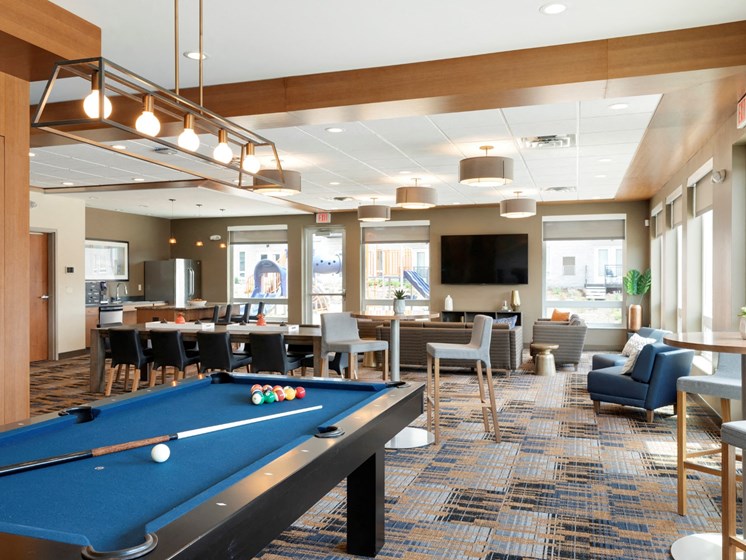 Clubhouse with pool table at The Liberty Apartments and Townhomes in Golden Valley, MN