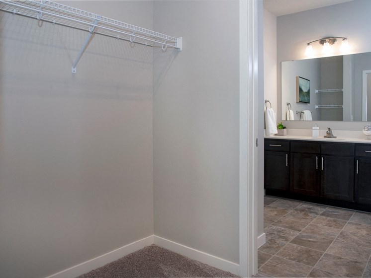 Large walk in closet and double vanity bathroom at The Sixton apartments in Shakopee, MN
