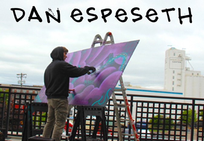 Dan Espeseth standing in front of his mural work