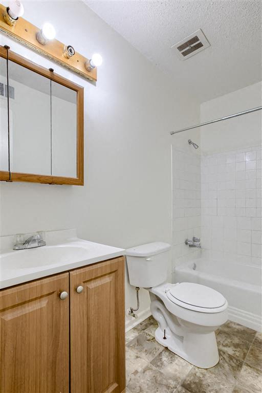 a bathroom with a toilet and a sink