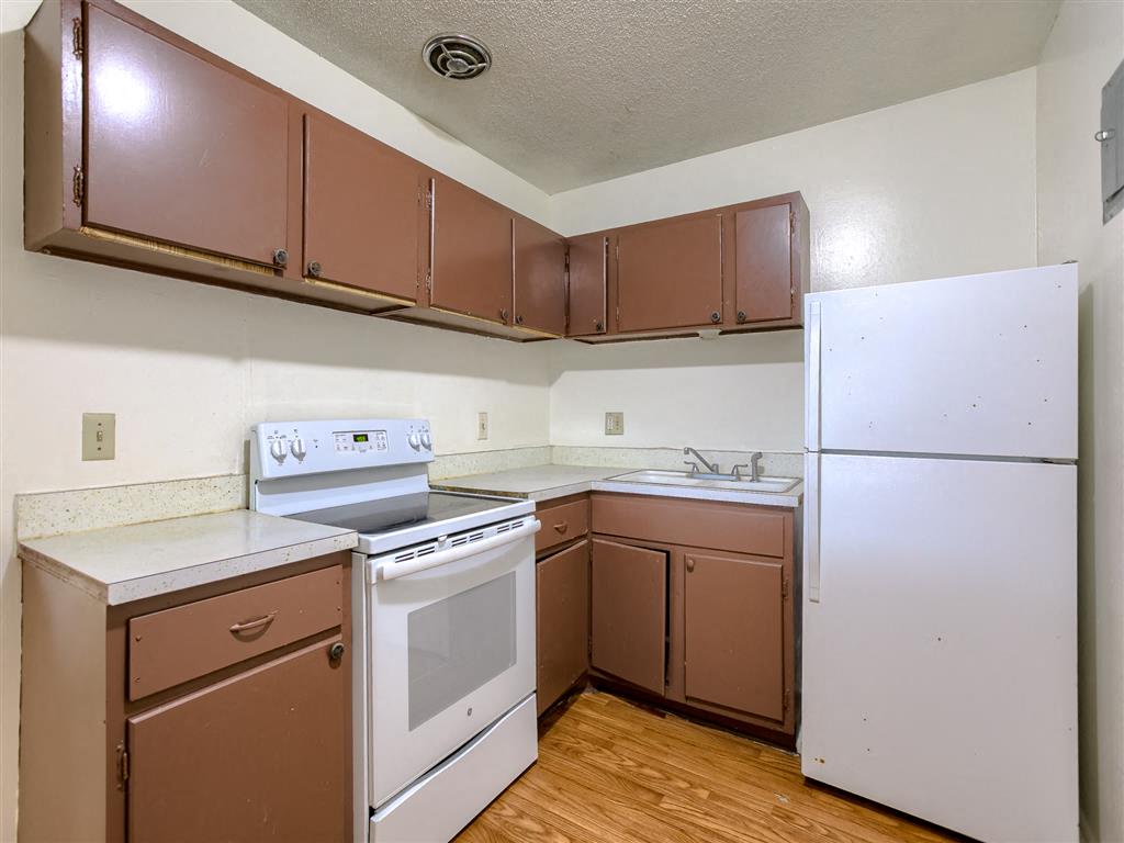 a kitchen with a counter top and cabinets