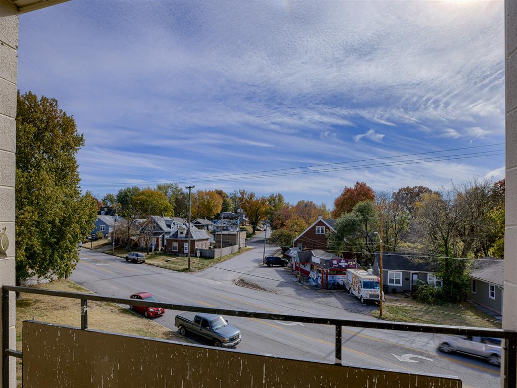 a view of a city street from a balcony