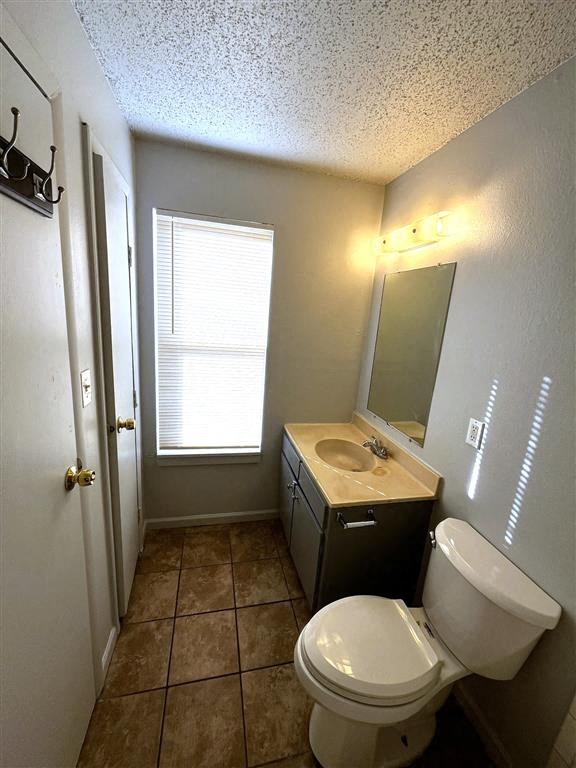 a bathroom with a toilet and a sink