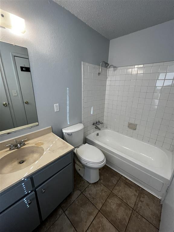 a bathroom with a sink, toilet and a bath tub