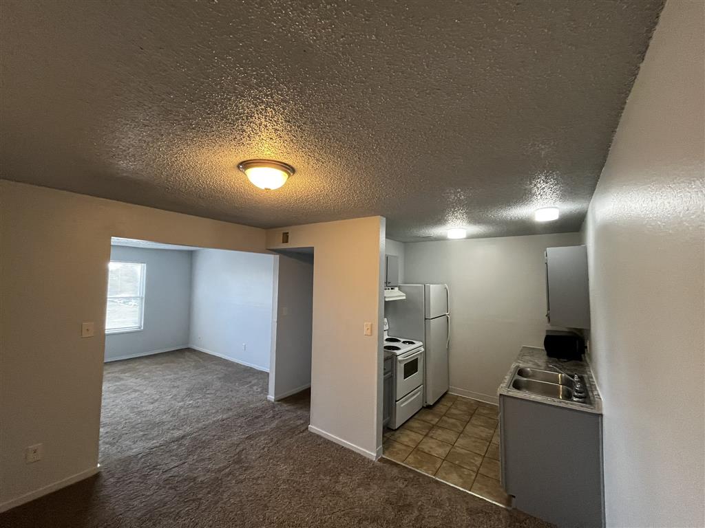 dining room view of the living room and kitchen