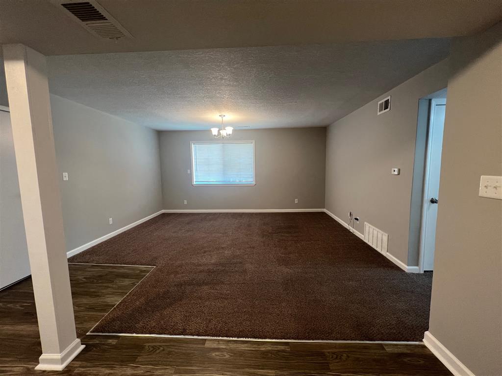 an open view of the living room with a window