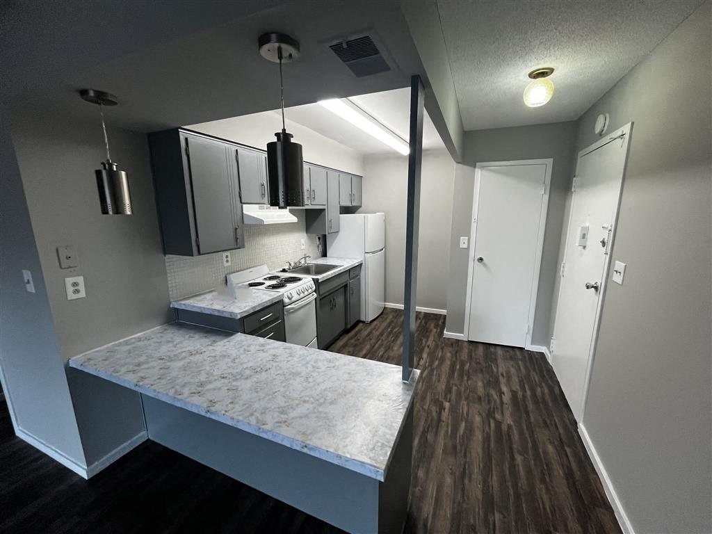 an aerial view of a kitchen with granite countertops