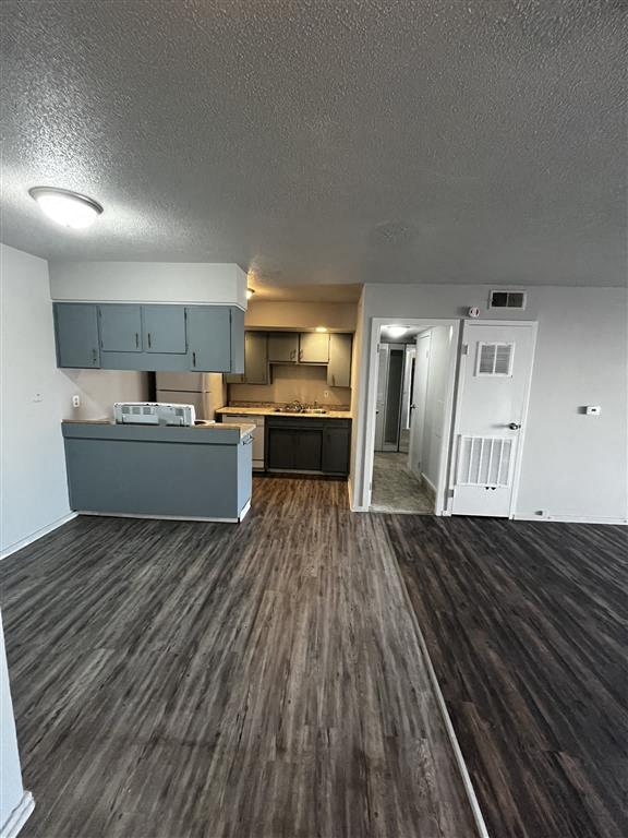 a front door view of the dining room and kitchen