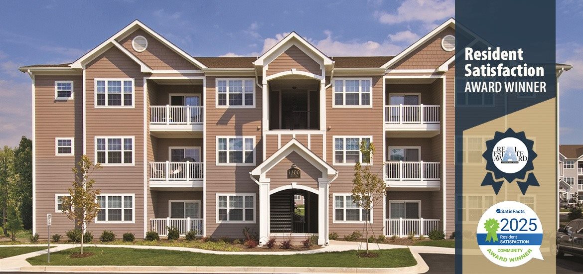 A residential building with a sign indicating it is a resident satisfaction award winner.