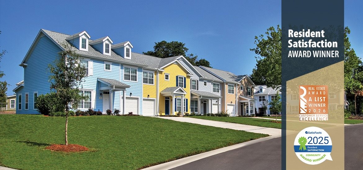 A residential neighborhood with a sign that says Resident Satisfaction Award Winner.