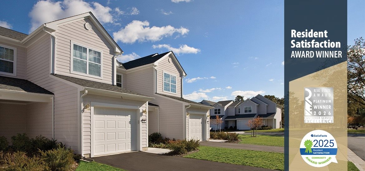 A residential building with a sign that says "Resident Satisfaction Award Winner".