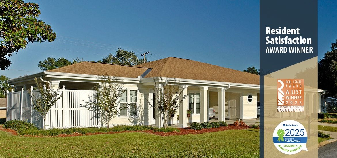 A white house with a brown roof and a sign that says "Resident Satisfaction Award Winner".