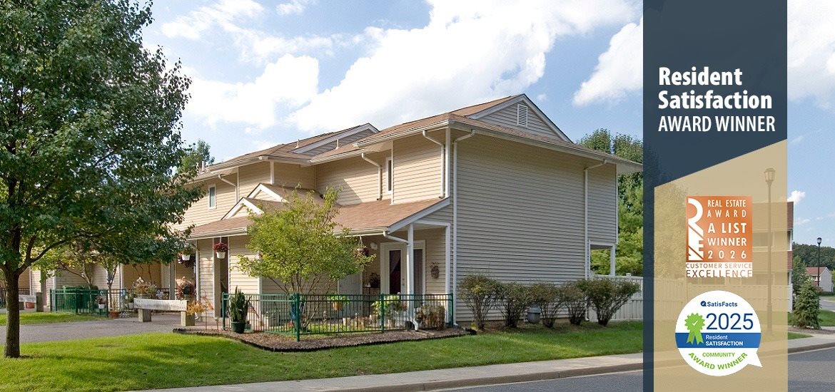 A residential building with a sign indicating it is a resident satisfaction award winner.