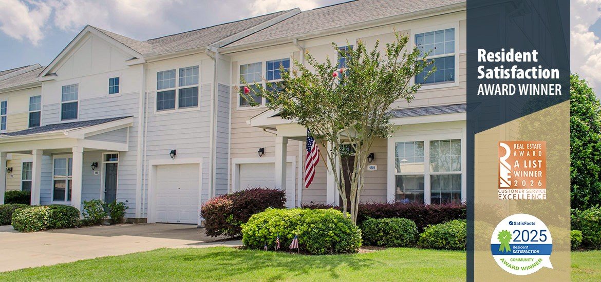 A residential building with a sign indicating it is a resident satisfaction award winner.