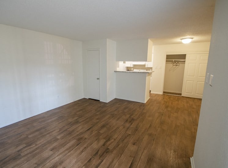 This is a photo of the living room in a 704 square foot 1 bedroom apartment at The Boulders Apartments in Garland, TX.