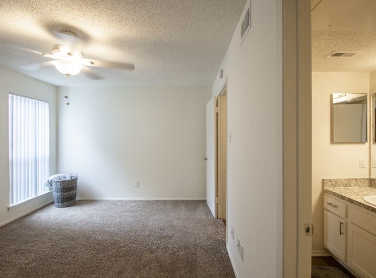 This is a photo of the bedroom in a 704 square foot 1 bedroom apartment at The Boulders Apartments in Garland, TX.