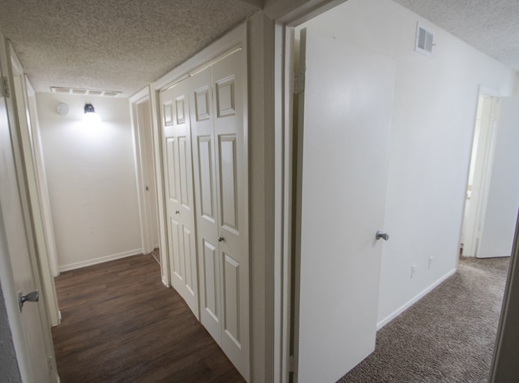 This is a photo of the hallway closet which conatins teh washer dryer connections in a 1024 square foot 3 bedroom apartment at The Boulders Apartments in Garland, TX.