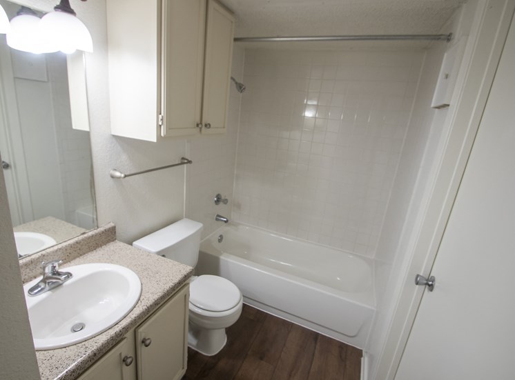 This is a photo of the primary bathroom in a 1024 square foot 3 bedroom apartment at The Boulders Apartments in Garland, TX.