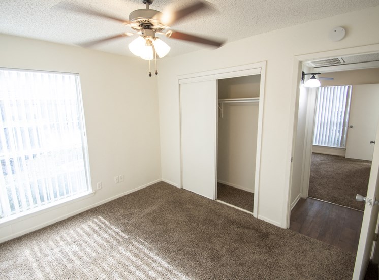 This is a photo of the third bedroom in a 1024 square foot 3 bedroom apartment at The Boulders Apartments in Garland, TX.