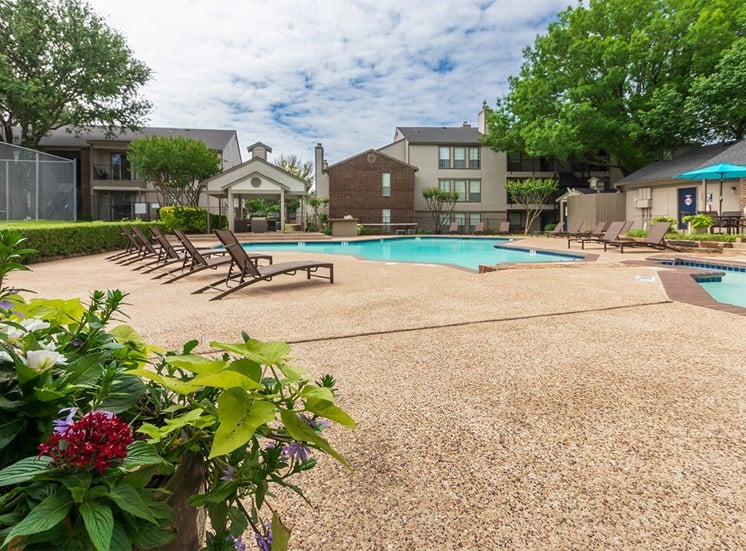 This is a photo of the pool area at The Boulders Apartments in Garland, TX.