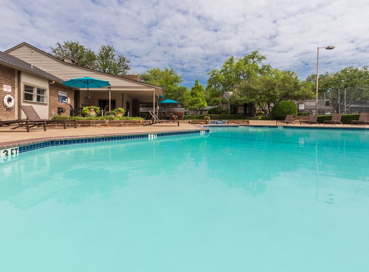 This is a photo of the pool area at The Boulders Apartments in Garland, TX.