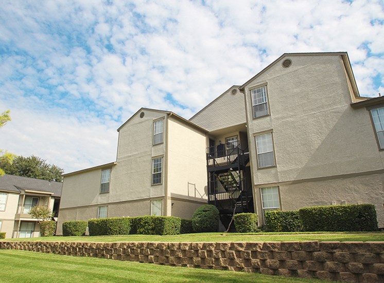 This is a photo of building exteriors at The Boulders Apartments in Garland, TX.