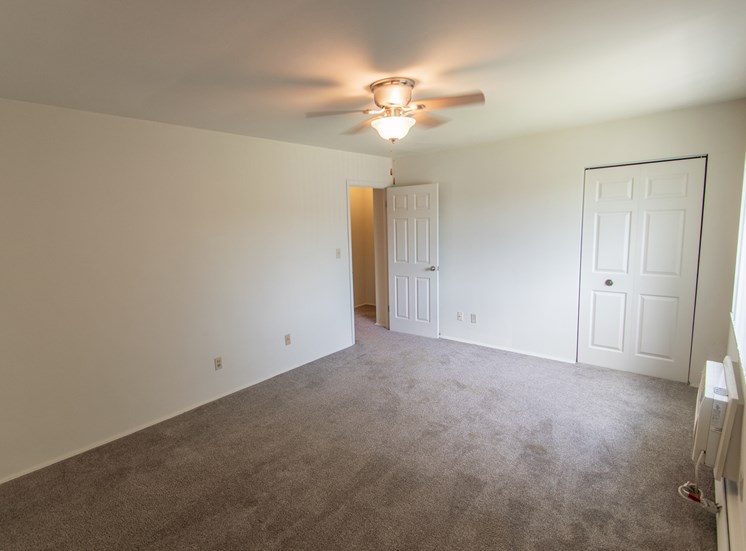 This is a photo of the primary bedroom in the 1004 square foot, 2 bedroom townhome floor plan at Colonial Ridge Apartments in Cincinnati, OH.
