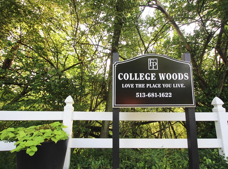 This is a photo of the entrance sign at College Woods Apartments in Cincinnati, OH.