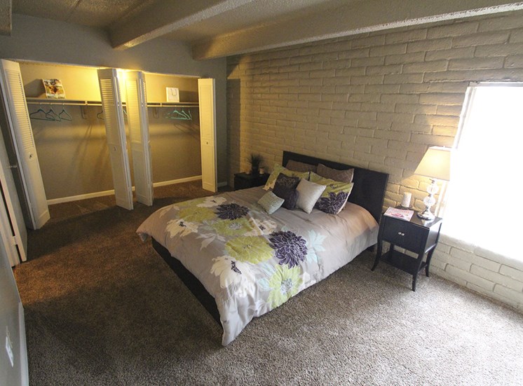 This is a photo of the bedroom in the 653 square foot 1 bedroom apartment at Harvard Square Apartments, in Dallas, TX.