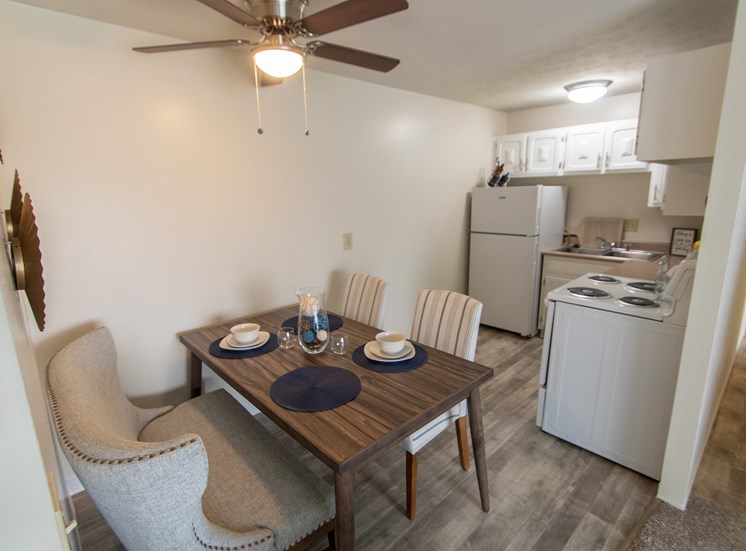 This is a photo of the dining area and kitchen in the 705 square foot 2 bedroom apartment at Lisa Ridge Apartments in Cincinnati, OH.