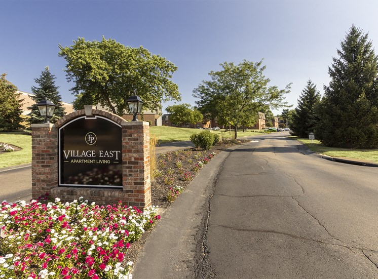This is a photo of the entrance sign at Village East Apartments in Franklin, OH.