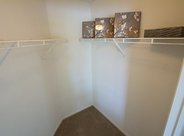 This is a photo of the primary bedroom walk-in closet of the 1100 square foot 2 bedroom Kettering at Washington Park Apartments in Centerville, OH.