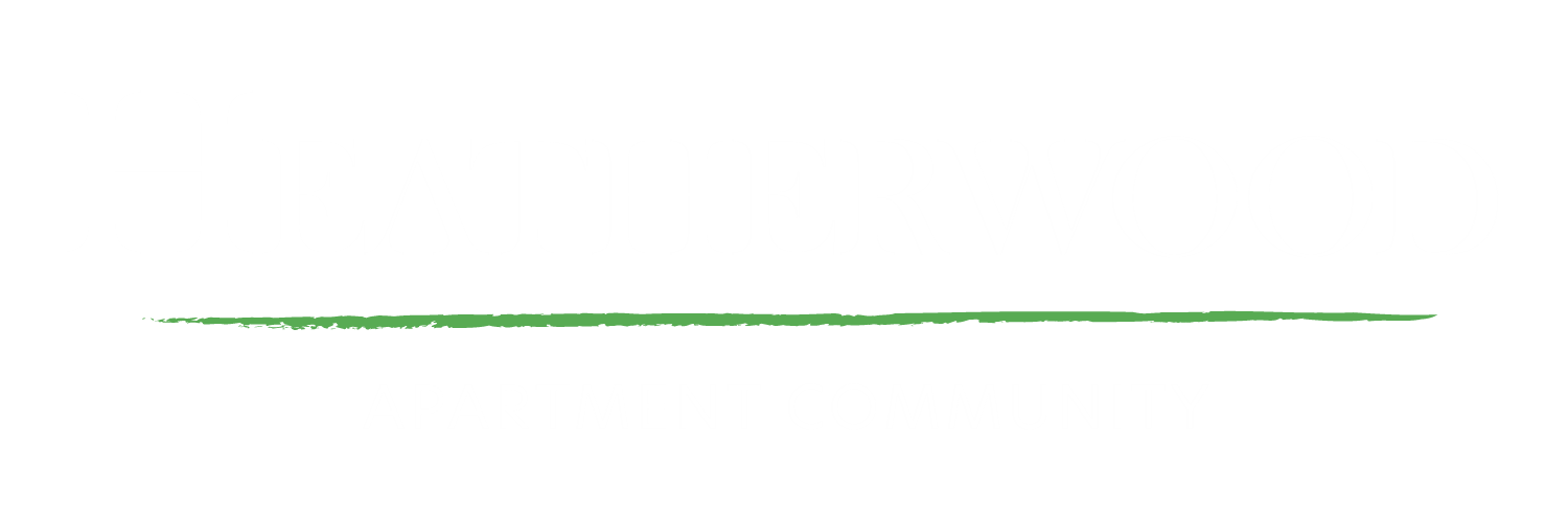 The image is a logo for Heatherwood Apartment Community.