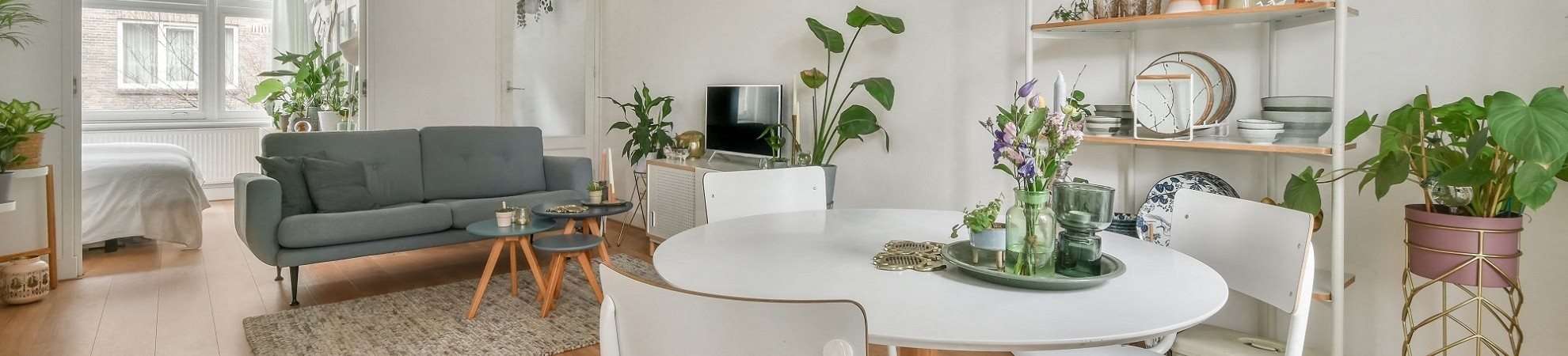 a living room with a table and a couch in it