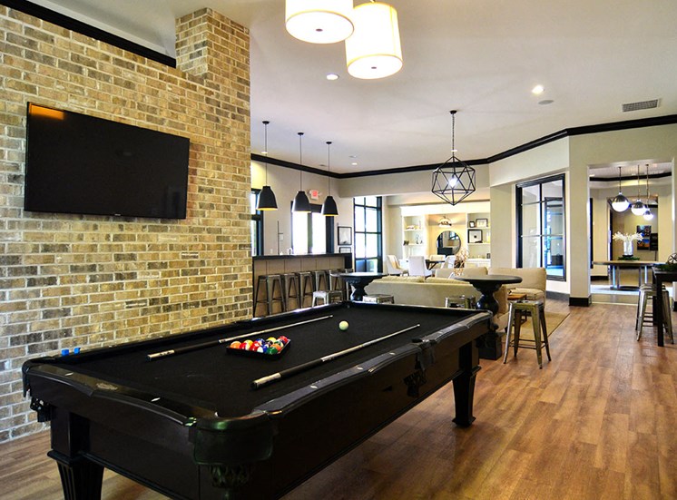 Billiards table and flat screen TVs in Clubhouse