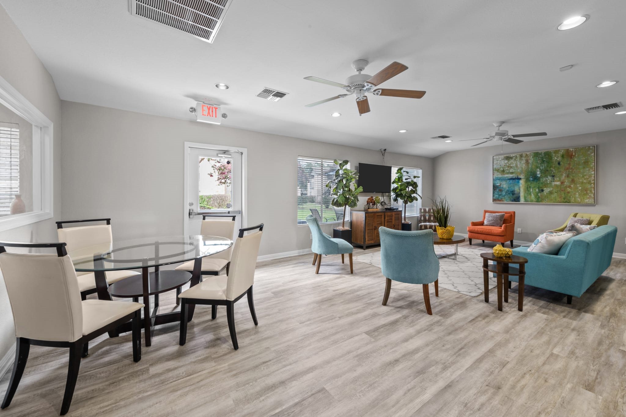 Dining area and living room with contemporary furniture at Peaks at Universal City Apartments, Universal City, TX 78148