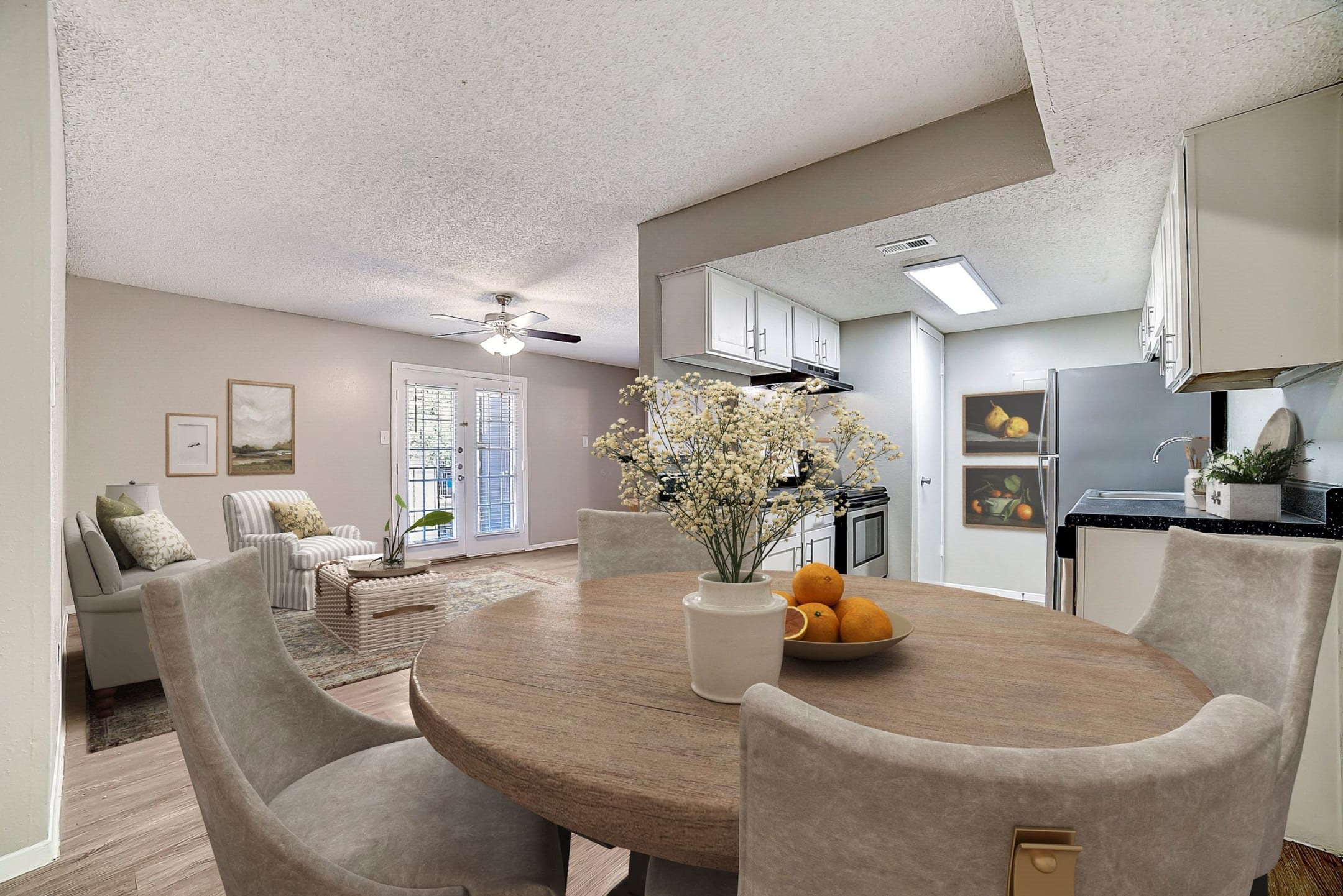 Open dining area with kitchen space at Peaks at Universal City Apartments, Universal City