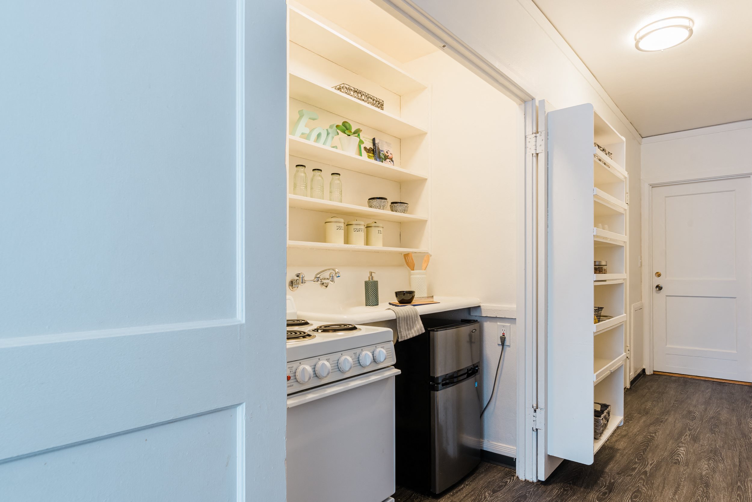 sample studio apartment Efficient kitchen with space saving design