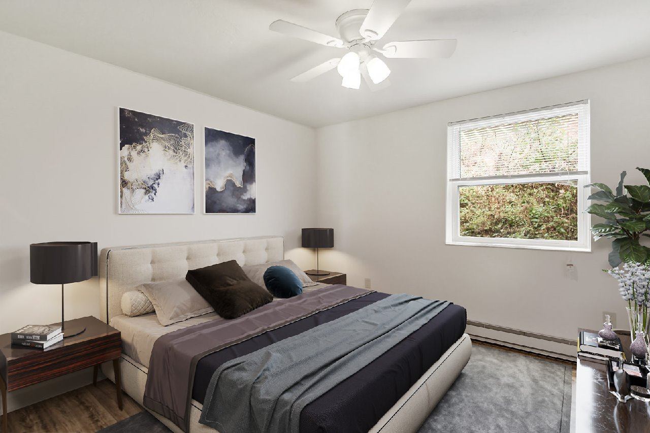 A living room with a grey couch and a coffee table.
